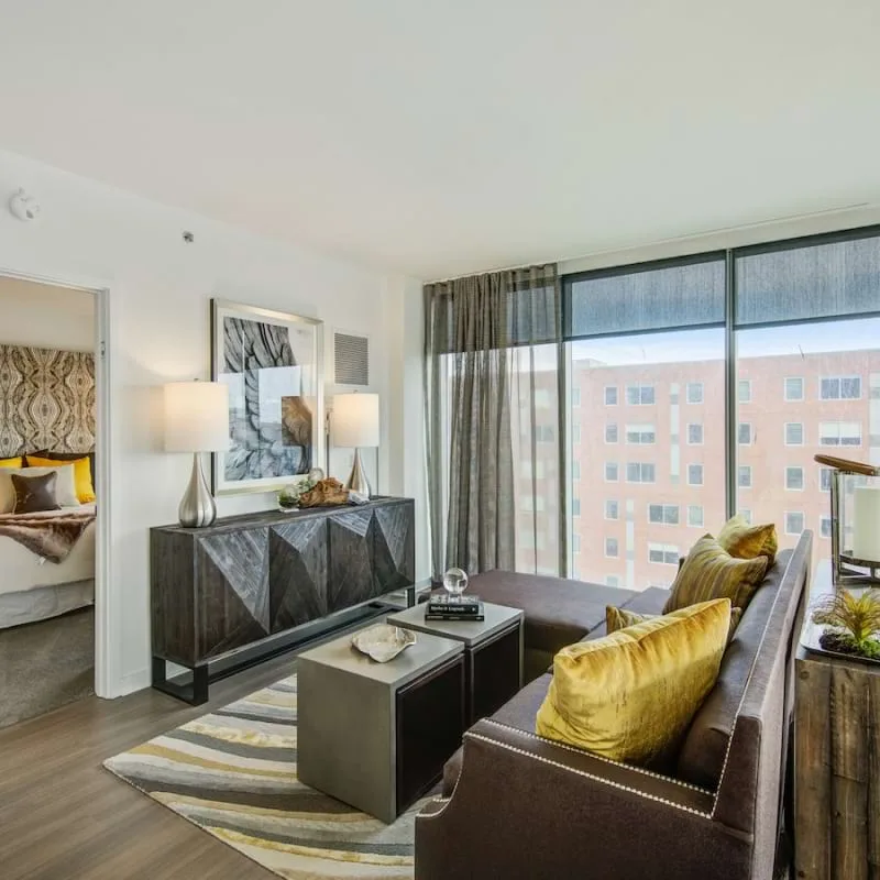 Living room and floor-to-ceiling windows at The Lumen