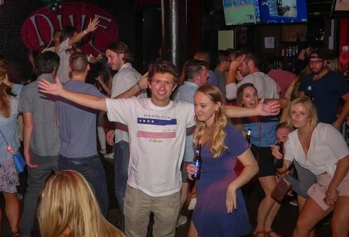 Guests watching a game at Dive Bar