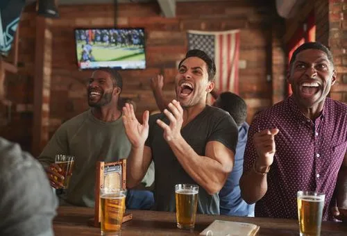 Guests reacting to a game at The Basement Sports Bar
