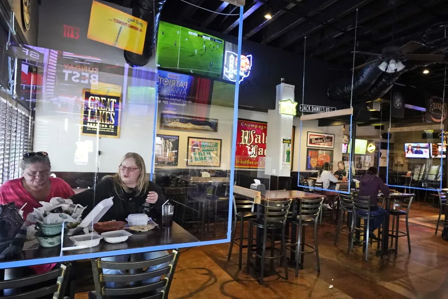 Guests inside Winking Lizard in Beachwood