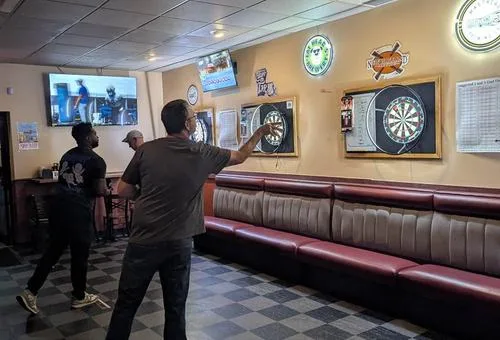 Dartboards and seating at Grindstone Tap House