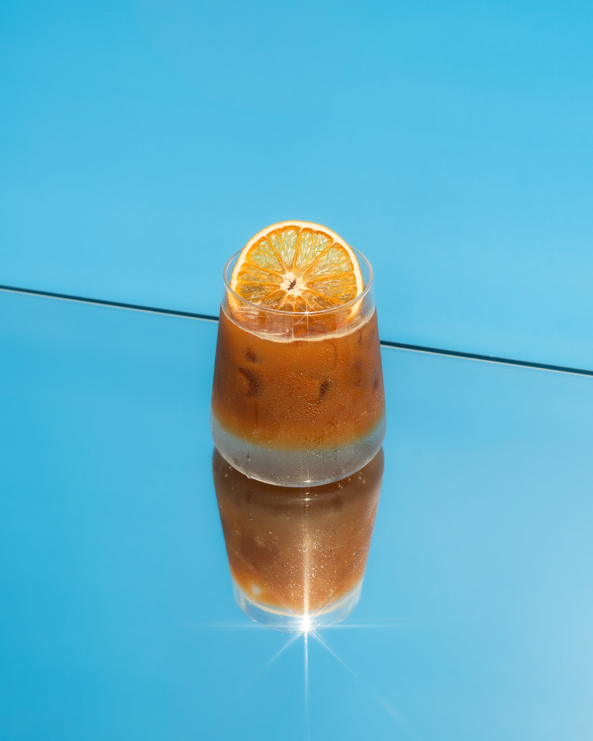 Citrus-topped iced coffee drink from Vessel Coffee Collaborative
