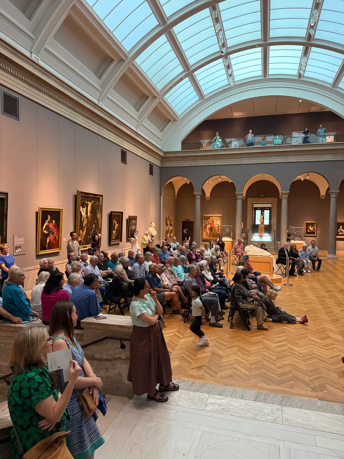 Visitors gathered in a gallery at the Cleveland Museum of Art