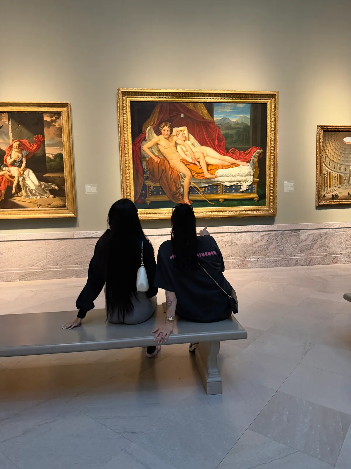 Visitors looking at paintings in the Cleveland Museum of Art