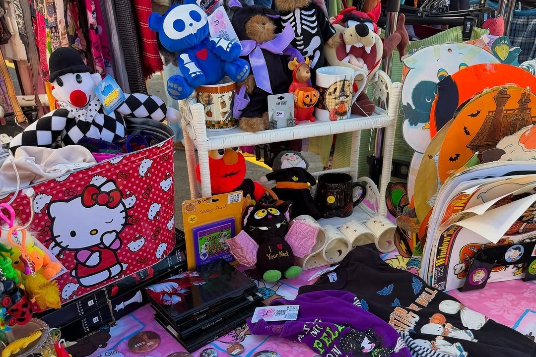 A vintage vendor table of plush toys, buttons and tees at the Manic Pixie Dream Market in Lakewood