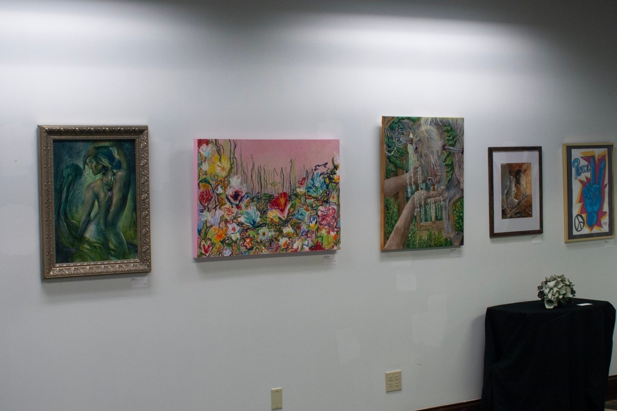 Paintings hung for a juried show at LZ Gallery during the Screw Factory Art Market in Lakewood