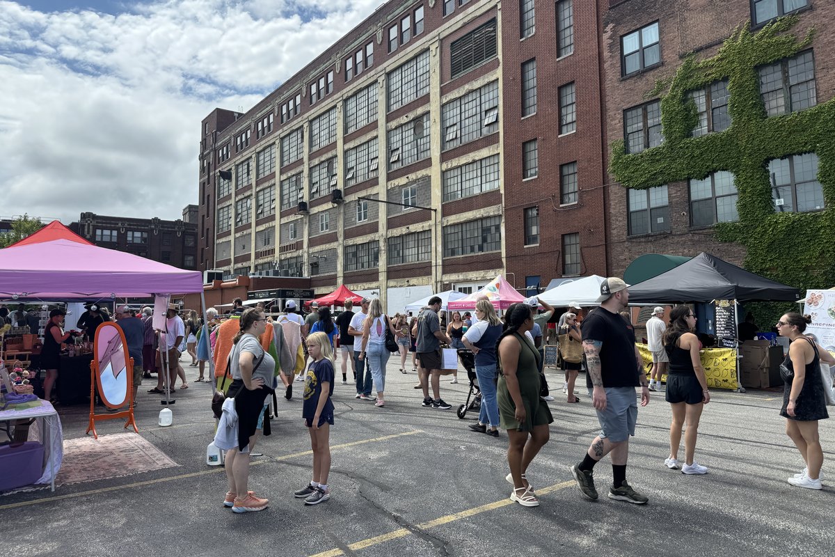 Shoppers browsing vendor tents at The Cleveland Market at Tyler Village in Cleveland on August 3, 2024