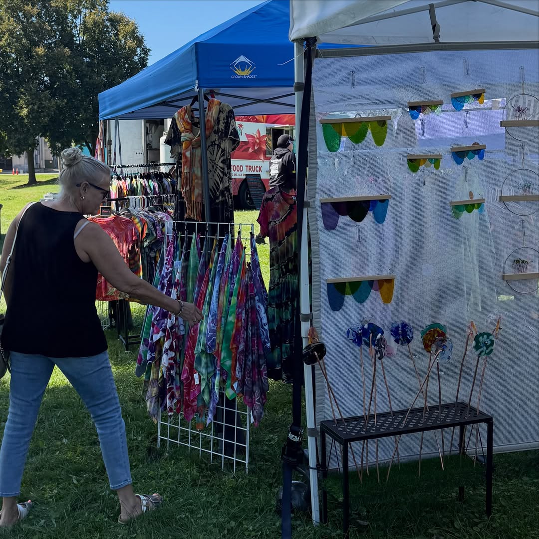 Shopper browsing vendor booths at the Akron Bazaar in Hardesty Park in Akron