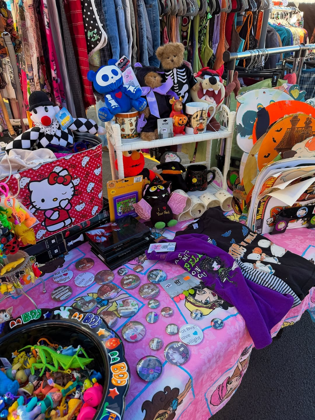 A vintage vendor table of plush toys, buttons and tees at the Manic Pixie Dream Market in Lakewood