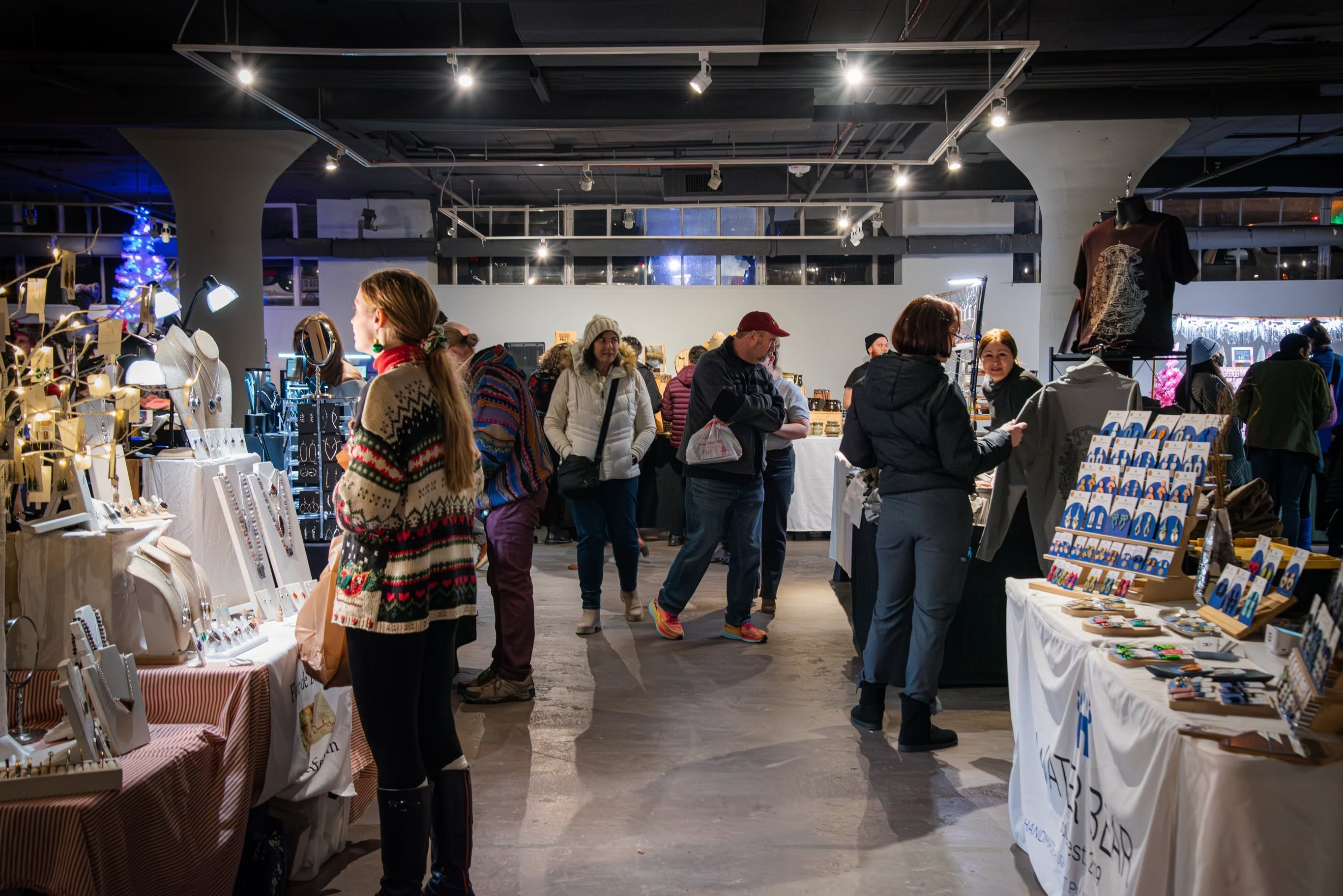 Shoppers browsing artist and vendor tables at 78th Street Studios in the Gordon Square Arts District, Cleveland
